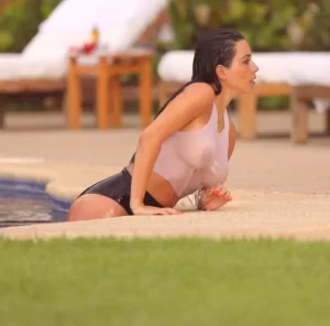 kim k in wet tshirt as she exits an outdoor pool
