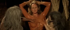 topless women smearing mud over ursula andress naked body