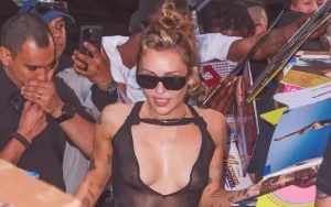 miley cyrus boobs and nipples in transparent dress while signing autographs in new york city, June 2025