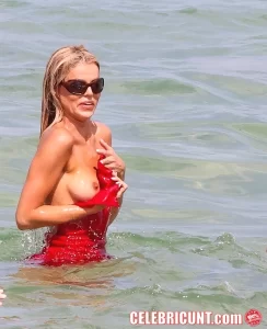 brooks nader has a tit slip in the sea, May 2026