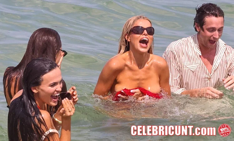 brooks nader has a tit slip and nip slip in the ocean at miami beach in may 2026